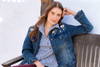 woman in denim jacket