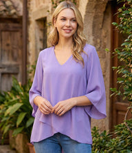 Bracelet Sleeve Asymmetric Top in silky crepe with flare sleeves and layered asymmetrical hem