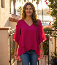 Bracelet Sleeve Asymmetric Top in silky crepe with V-neck, flare sleeves, and layered asymmetrical hem for elegant day-to-night wear