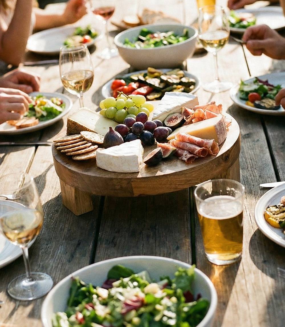 Footed Round Charcuterie Board made of mango wood with natural grain and raised design