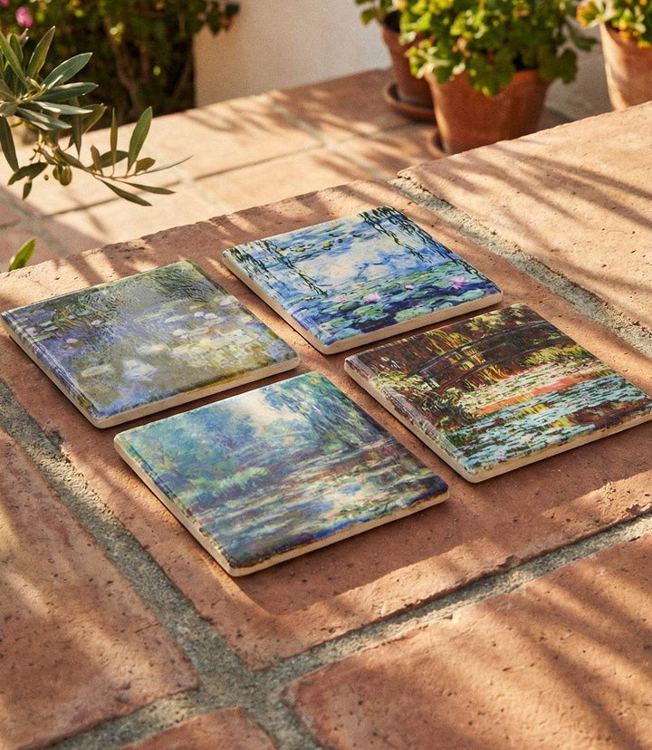 Set of four Monet Tile Marble Coasters featuring water lily designs on tumbled marble