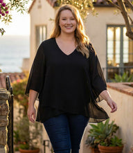 Plus size bracelet sleeve asymmetric top in silky crepe with v-neck and layered hem