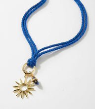 Sun and sodalite point cord necklace with gold-plated sun charm on cobalt cotton cord