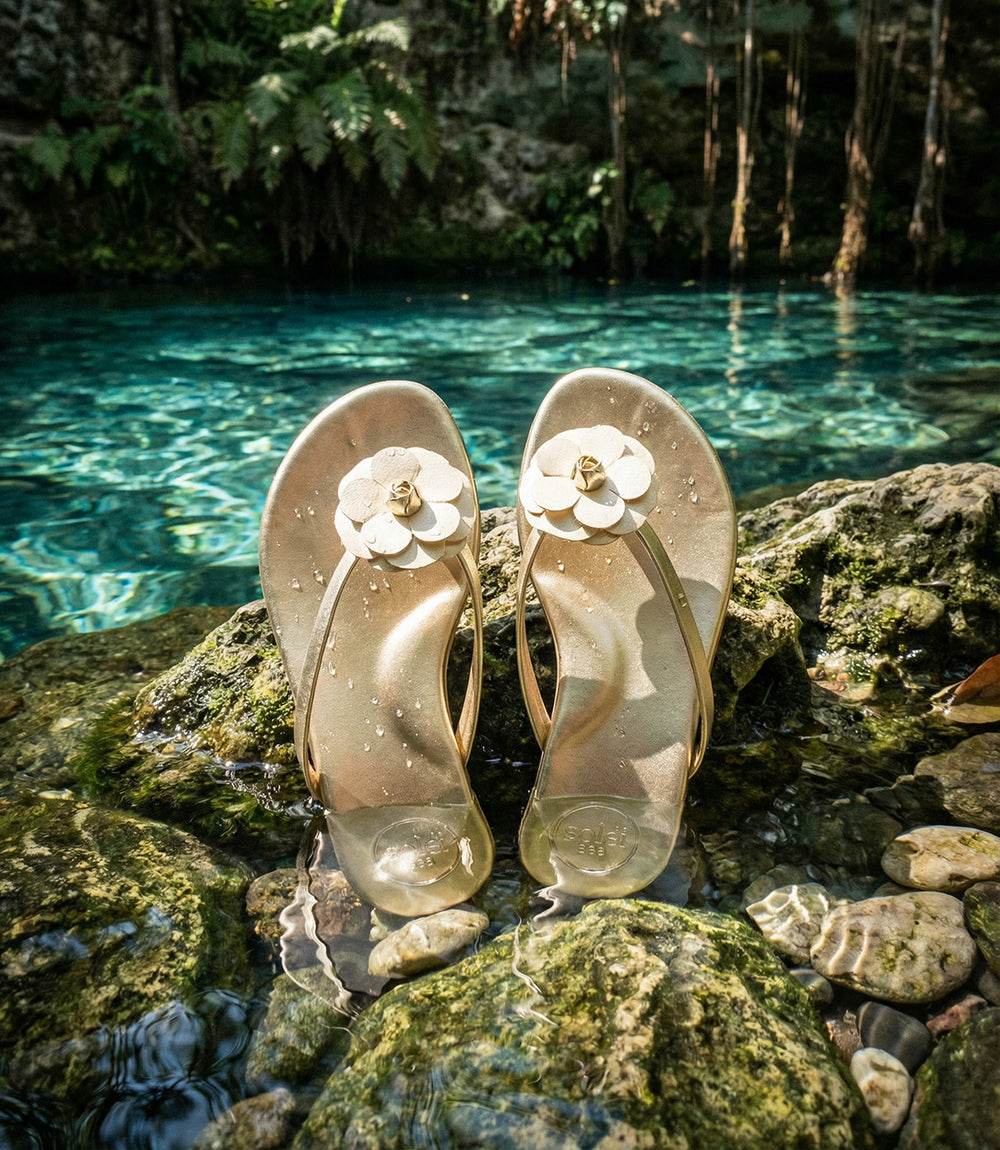 Solei Sea Valentina gold thong sandals with layered flower appliqué and minimalist straps