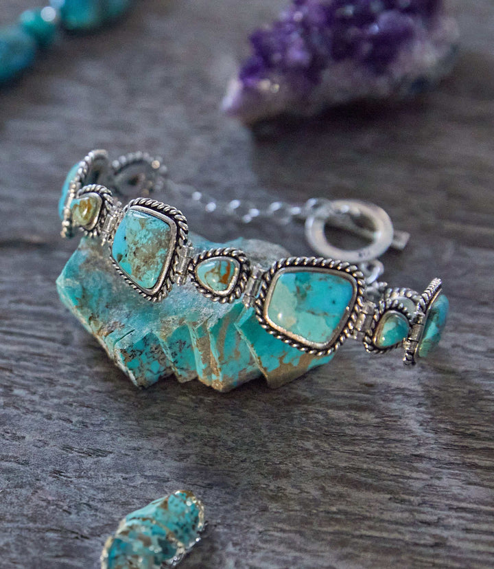 Handcrafted turquoise bracelet with sterling silver twisted wire rope setting