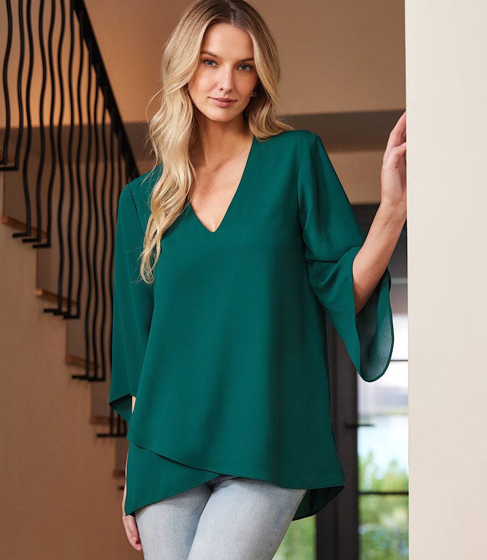 Petite size bracelet sleeve asymmetric top in green silky crepe with V-neck and layered hem
