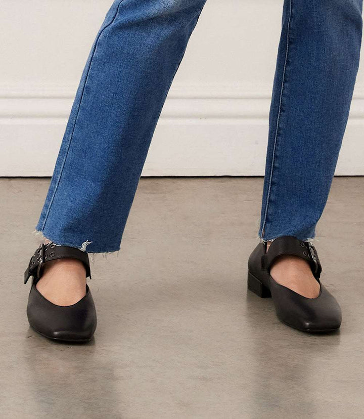 Seychelles Petal Mary Jane black square toe flats with oversized buckle and low heel worn with blue jeans