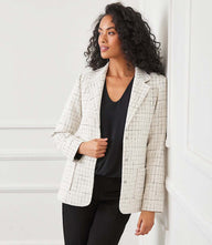 Cream tweed blazer with notched collar and snap closures, fully lined with front pockets