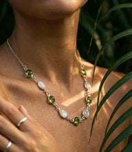 Moonstone and peridot station necklace with silver plated chain and alternating green peridot and luminous moonstone gemstones