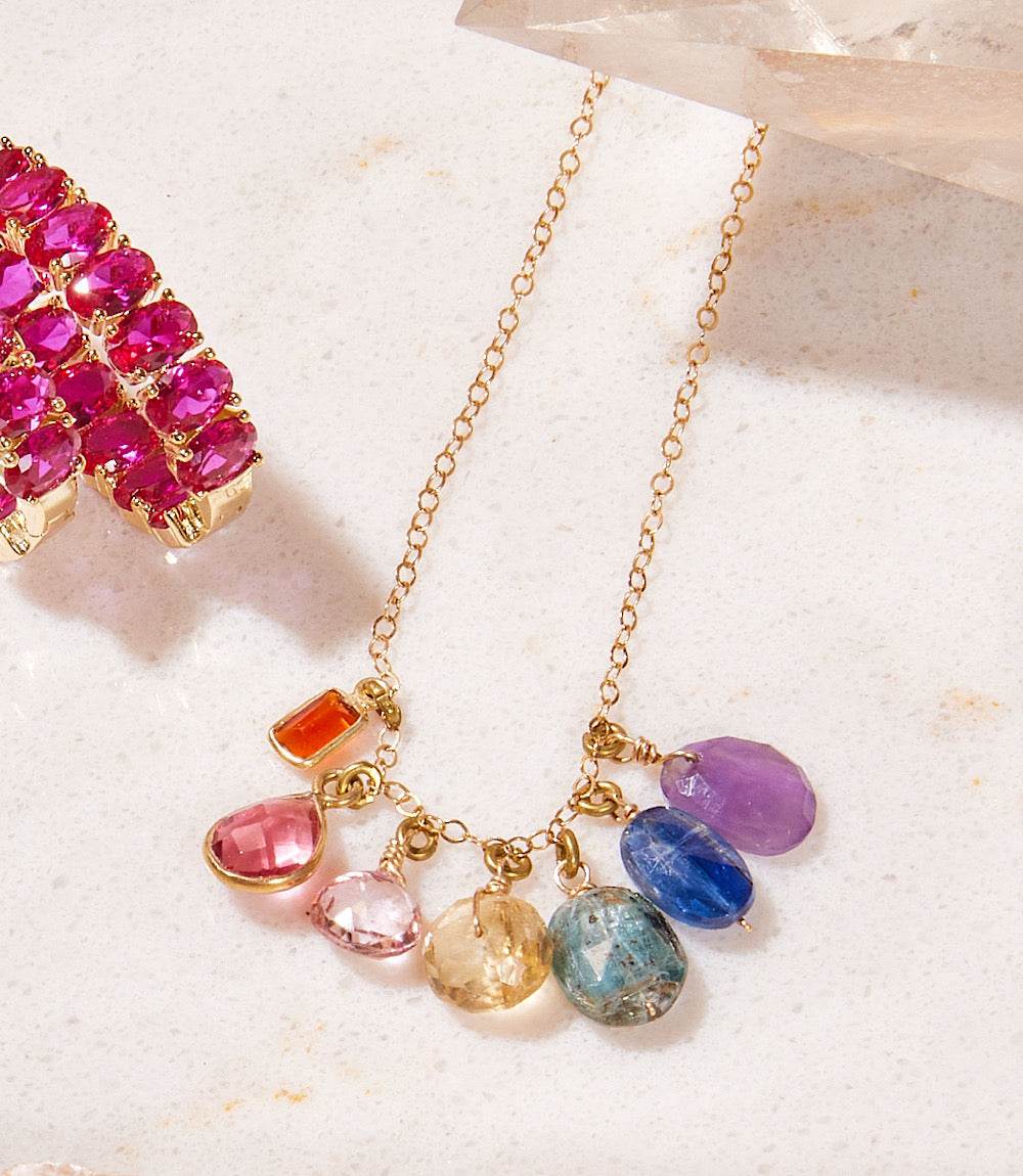 Colorful gemstone necklace with assorted charm stones on 14k gold vermeil chain