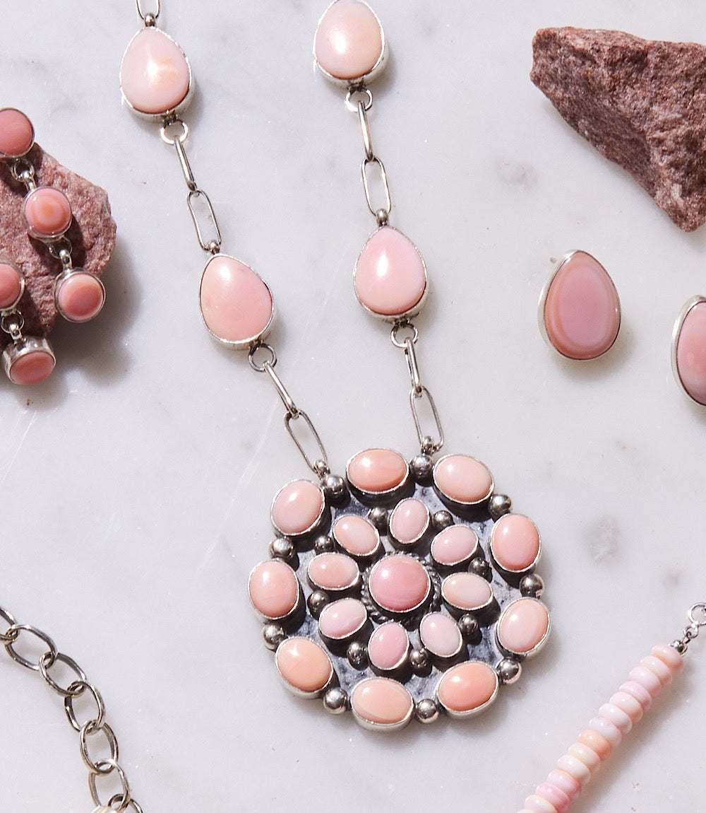 Pink conch shell necklace and earrings set with sterling silver accents handcrafted by Navajo artist