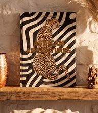 Lioness with cubs and elephant calf showcasing African Adventures wildlife and culture