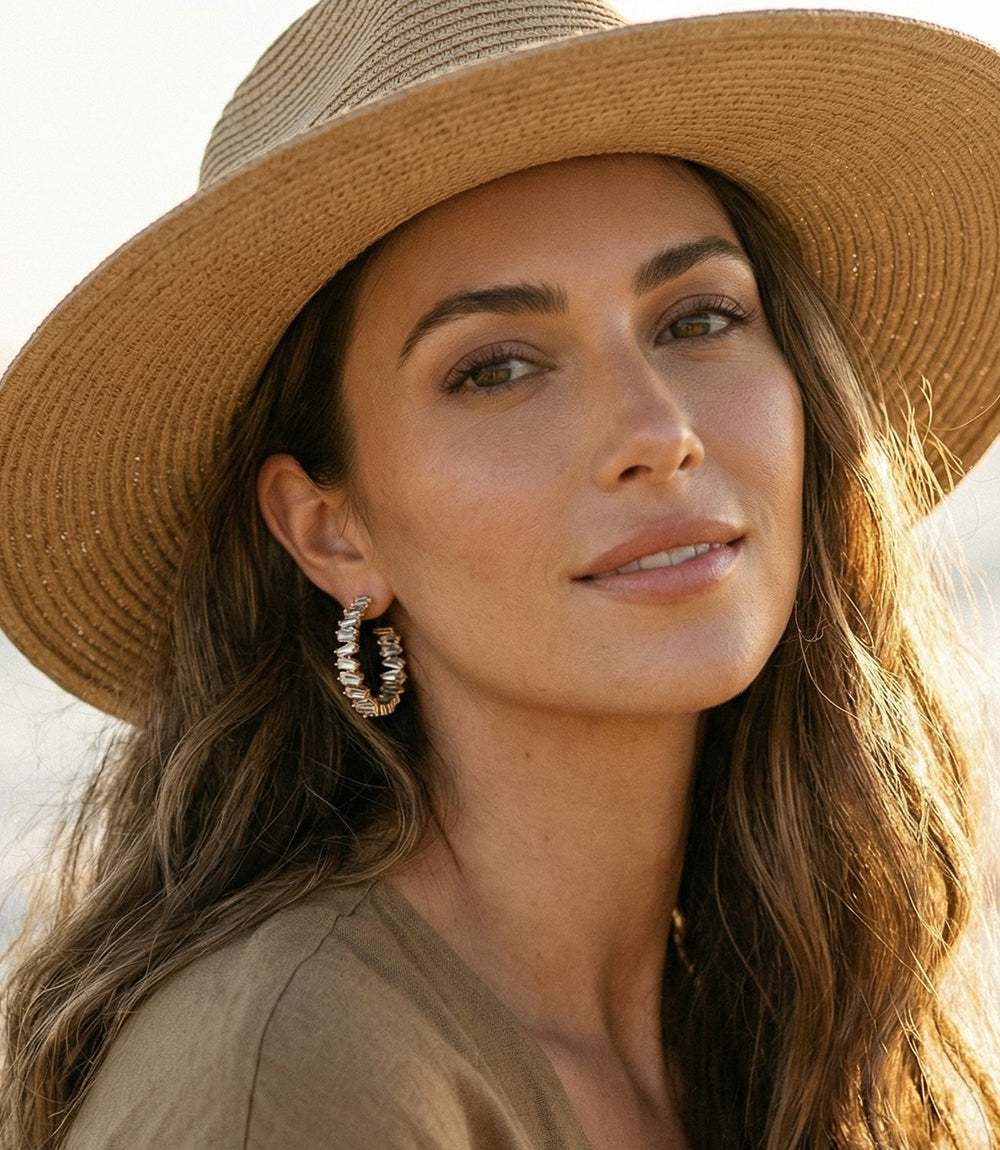 Angled crystal hoop earrings with clear blue crystals and 14k gold hoops