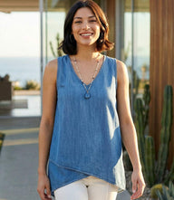 Sleeveless asymmetric tank top with V-neck and crossover hem in soft washed Tencel fabric.