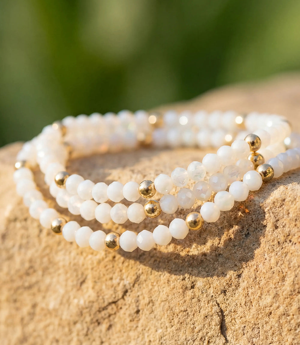 Set of 3 beaded crystal bracelets with white glass beads and gold-filled accents, perfect for layering or individual wear