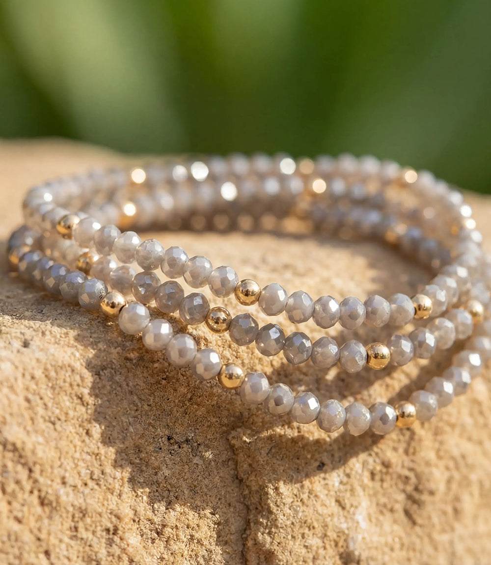 Set of 3 beaded crystal bracelets with light gray glass and gold-filled beads, easy slip-on design