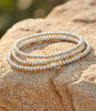 Set of 3 beaded crystal bracelets with platinum-toned glass and gold-filled beads, elegant and versatile slip-on design