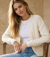 Chunky cable knit cardigan sweater with V-neck and button front closure