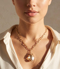 Crystal pendant necklace with faceted Swarovski topaz on gold-plated chain and lobster clasp