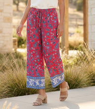 Drawstring border print cropped pants with red and blue floral batik design and wide-leg silhouette
