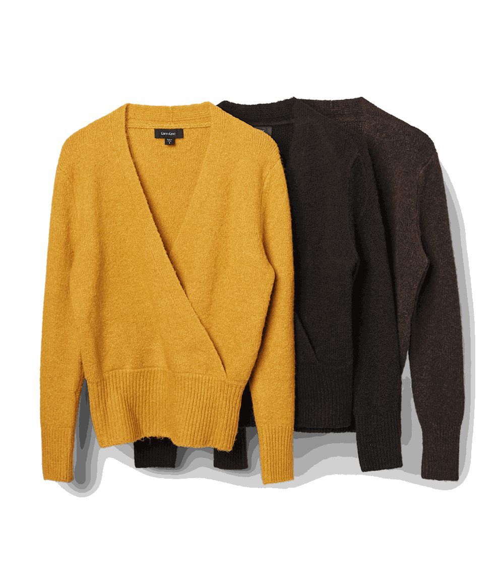 Three wrap sweaters in mustard yellow, black, and brown with faux wrap design, crossover V-neckline, long drop shoulder sleeves, and wide ribbed edges at hem and cuffs.