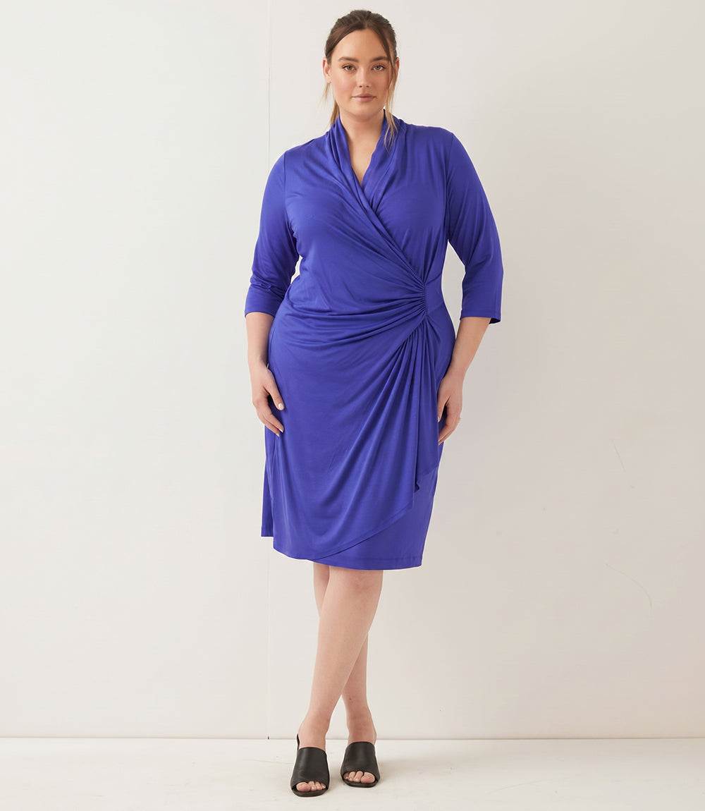 Plus size 3/4 sleeve cascade wrap dress with V-neckline and faux wrap front