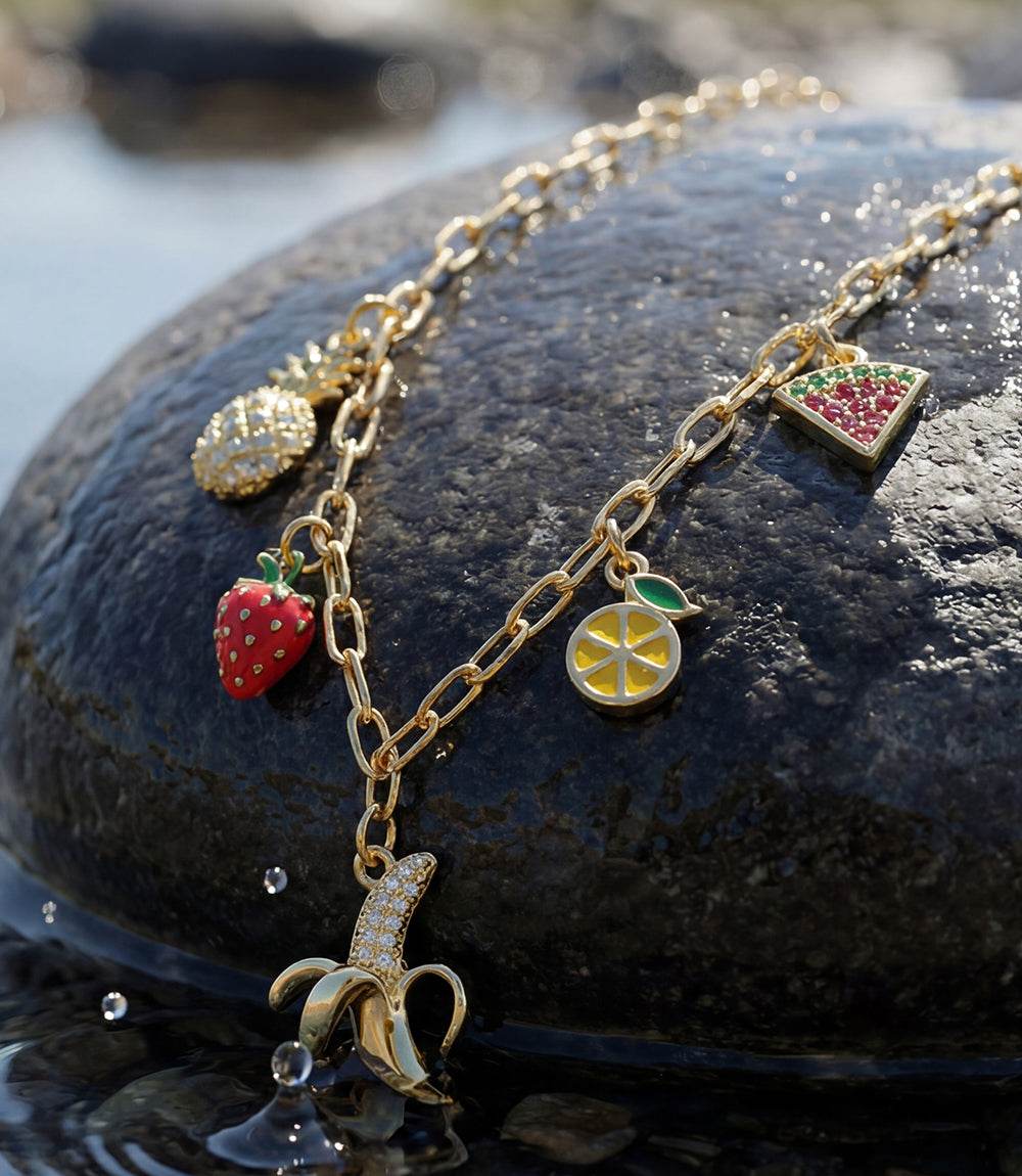 Fruit Salad Charm Necklace with gold chain and colorful fruit charms including banana, strawberry, pineapple, lemon, and watermelon