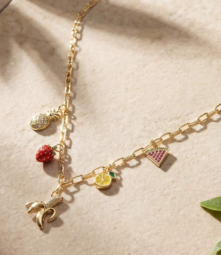 Fruit Salad Charm Necklace with gold chain and colorful fruit charms including banana, strawberry, pineapple, lemon, and watermelon