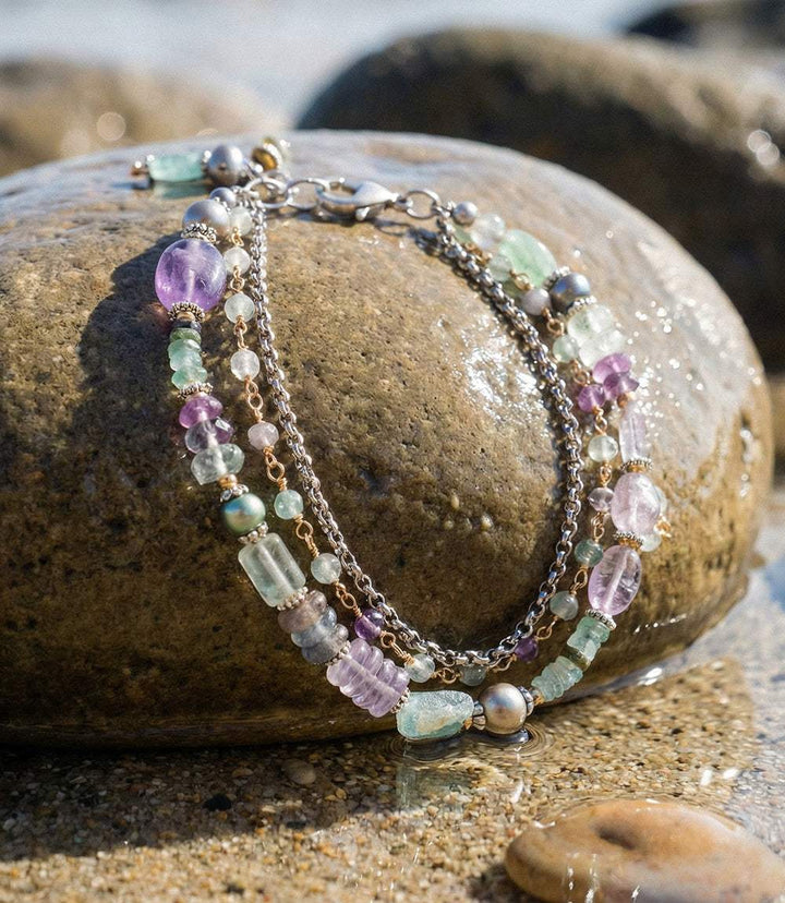Gemstone and glass multistrand bracelet with antique silver-plated brass, rainbow fluorite, freshwater pearl, amethyst, and artisan glass beads