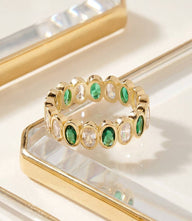 Minimalist gemstone ring with hand-set emerald and 14K gold fill band