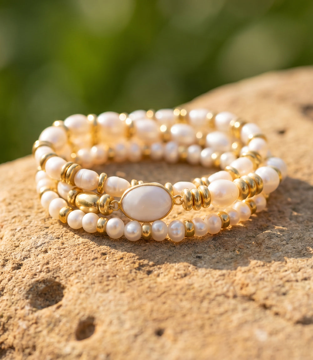 Set of 3 elegant pearl stack bracelets with mother-of-pearl and gold-tone details