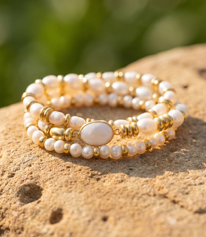 Set of 3 elegant pearl stack bracelets with mother-of-pearl and gold-tone details