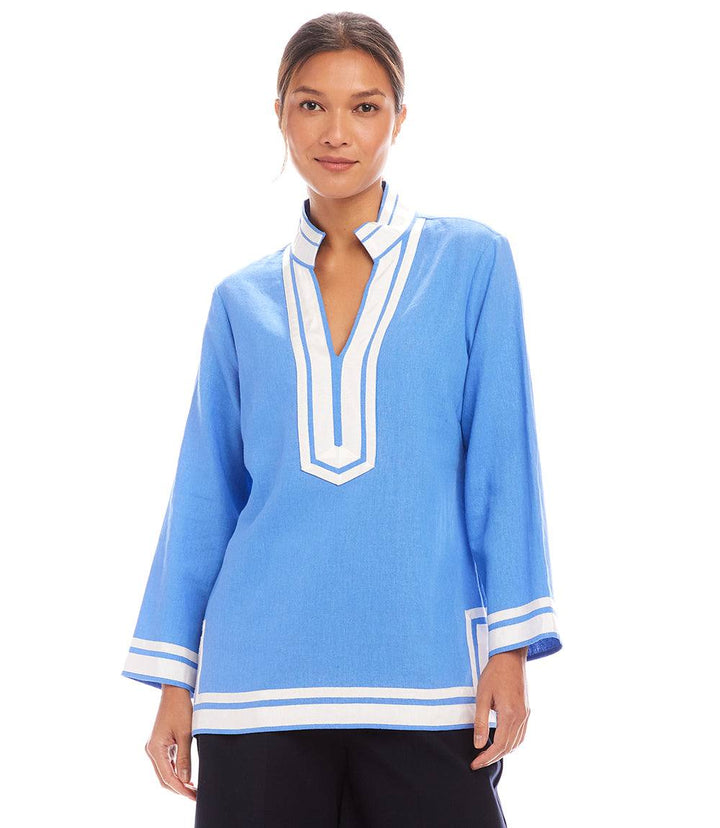 The St. Tropez Tunic in blue linen blend with white grosgrain ribbon trim and mandarin collar, featuring a relaxed fit and split neck design.