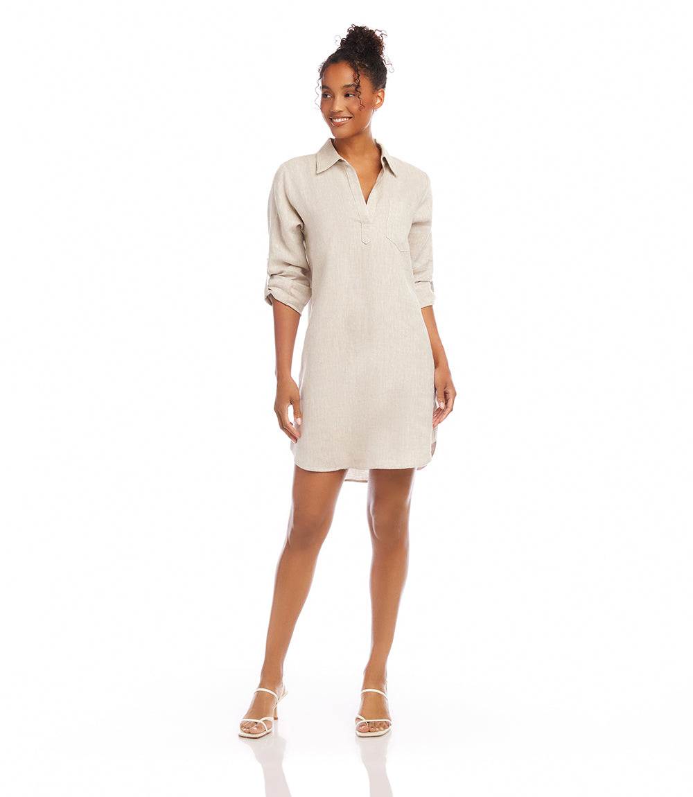 Woman wearing oatmeal roll tab linen shirtdress with collared neckline and shirttail hem
