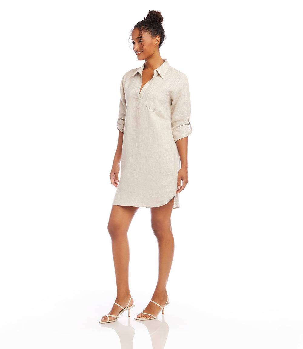 Woman wearing oatmeal-colored Roll Tab Linen shirtdress with roll-tab sleeves and front pocket