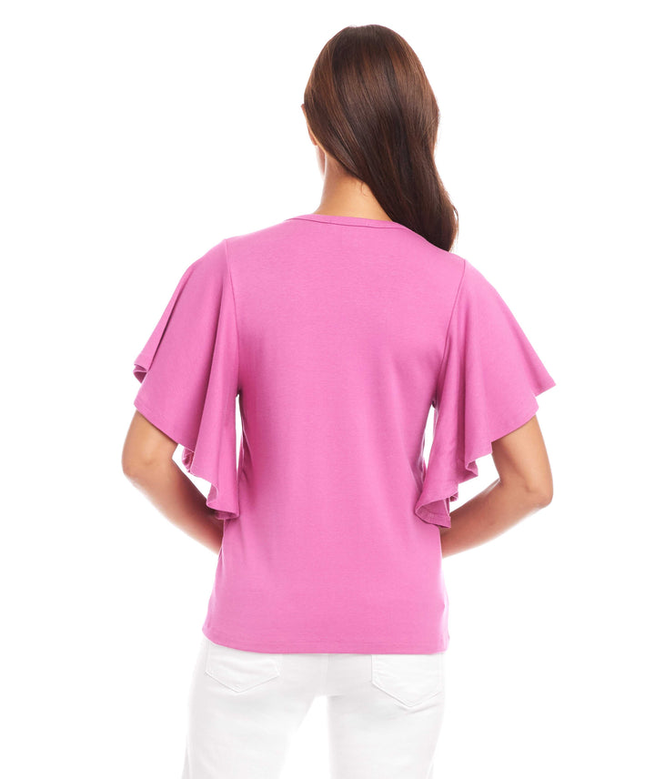 Back view of pink flutter sleeve top made from organic cotton blend with ruffled sleeves and fitted bust