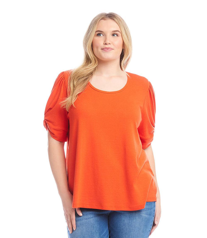Plus size orange twist sleeve top with puff sleeves made from organic cotton and hemp blend