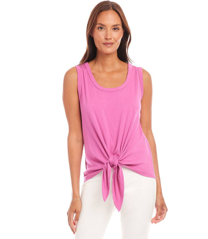 Woman wearing pink tie front tank top with scoop neck and white pants