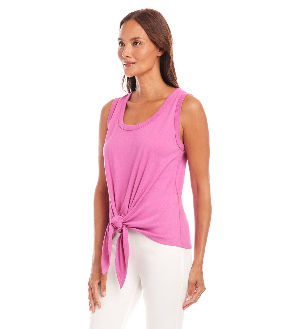Woman wearing a pink tie front tank top made of organic cotton with a scoop neck and fitted waist