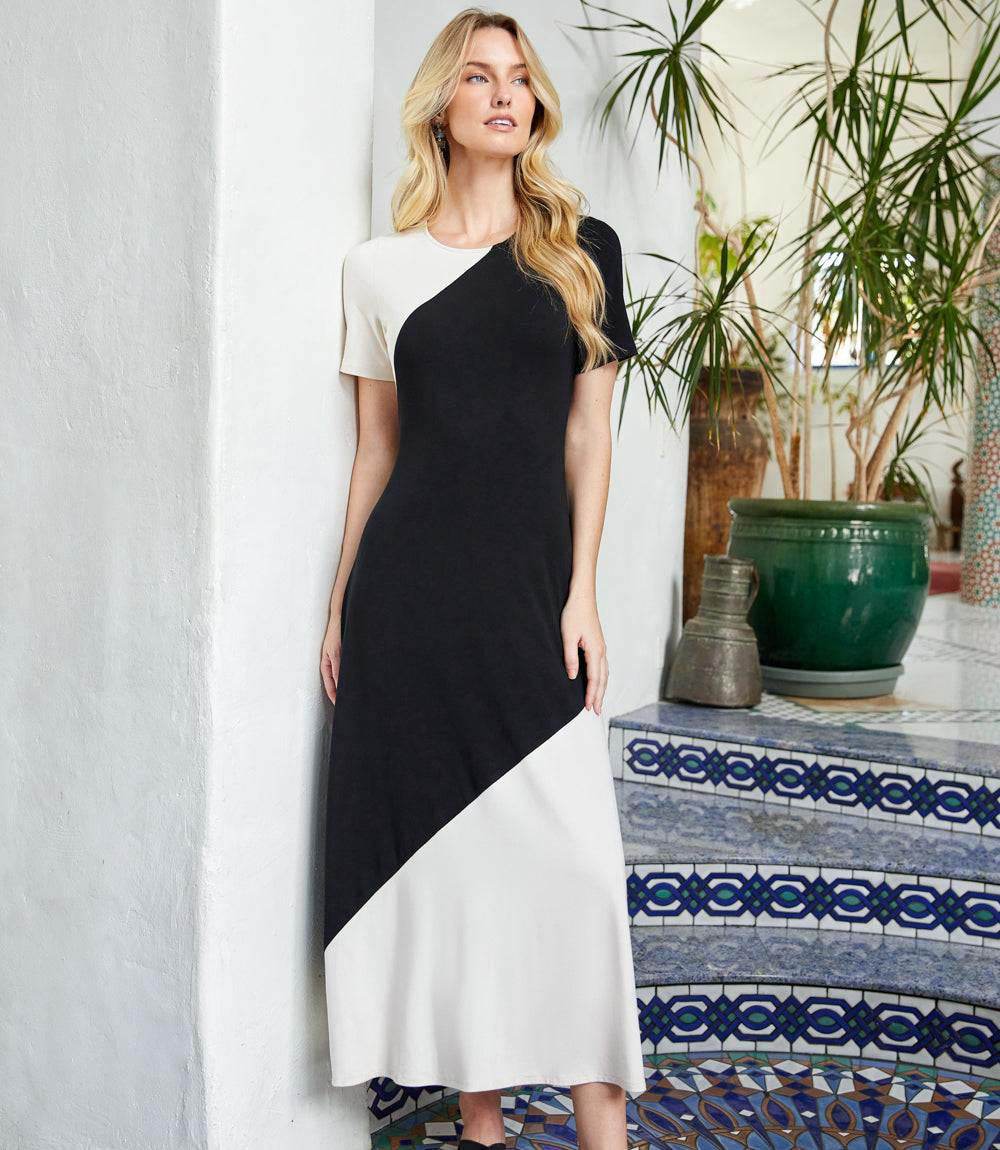 Woman wearing short sleeve contrast midi dress with scoop neck and midi length