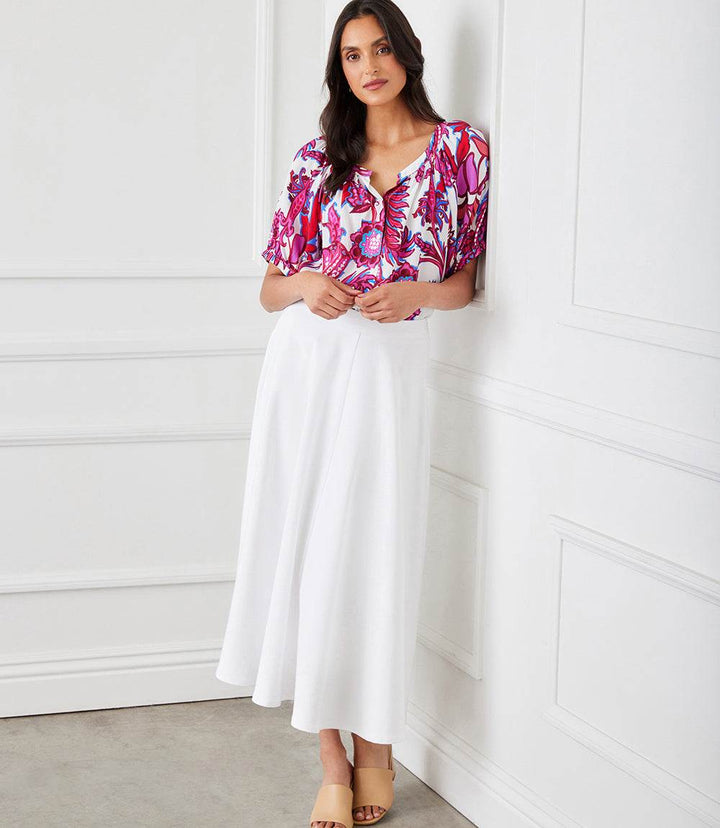 Petite short sleeve peasant top with peony paisley print, button-up front, scoop neck, and puff sleeves