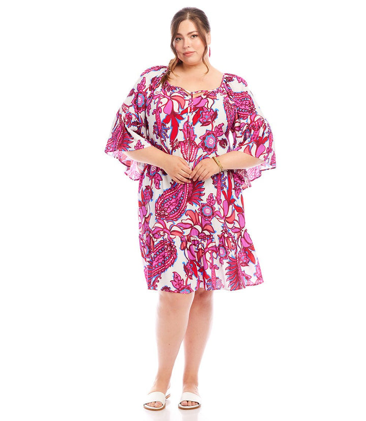 Plus size ruffle hem dress with peony paisley print, bell sleeves, and tie neck, made from lightweight viscose fabric.