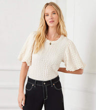 Petite size puff sleeve textured top with bubble knit and crew neck worn by woman