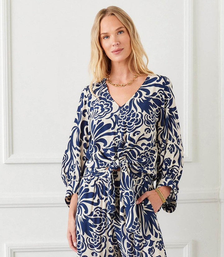 Petite size blouson sleeve tie front top in cream with navy paisley print and V-neck design