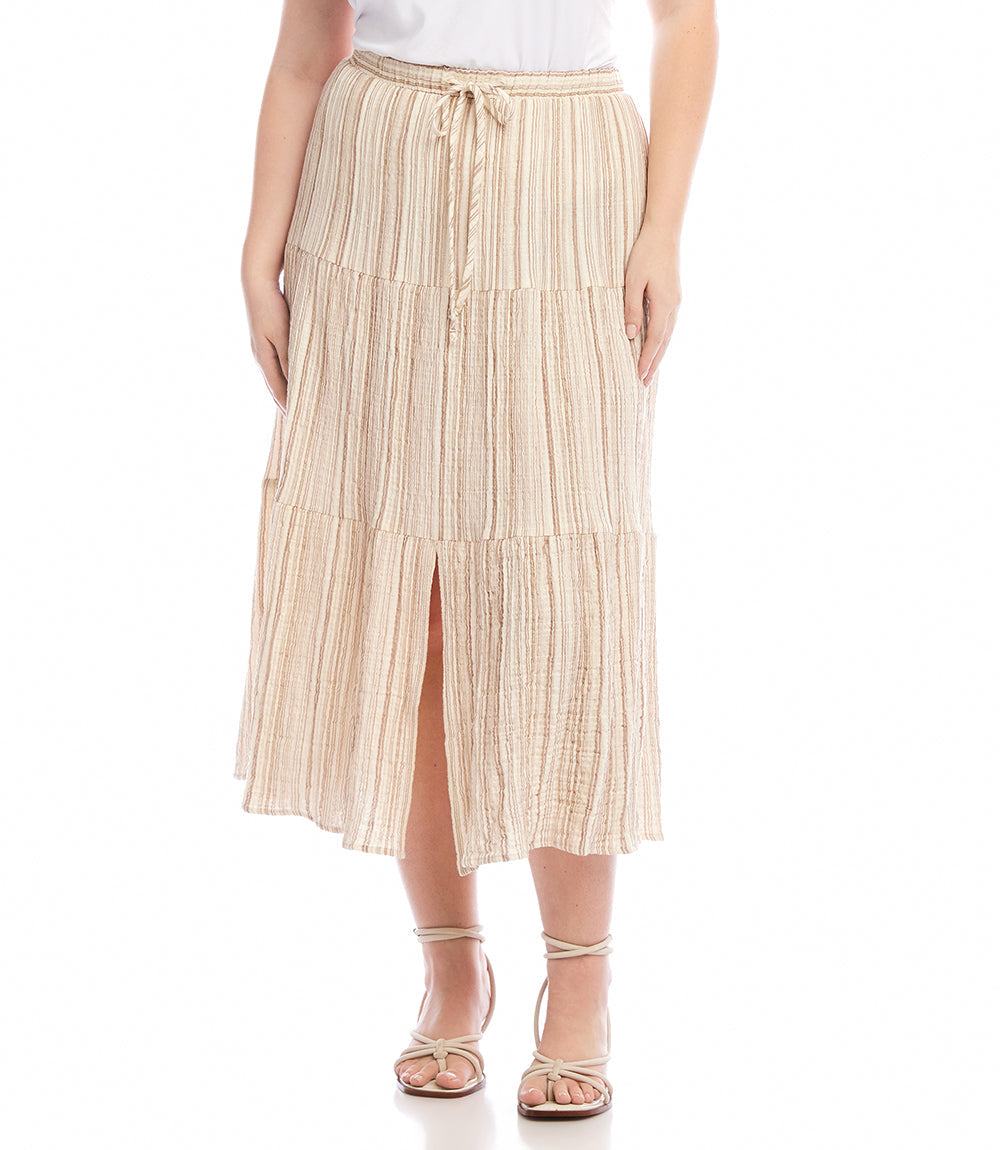Plus size metallic stripe tiered midi skirt with gold thread, elastic waistband, front slit, and pockets in cream and tan colors