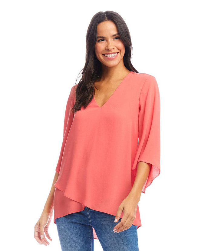 Petite size bracelet sleeve asymmetric top in coral with V-neck and layered hem