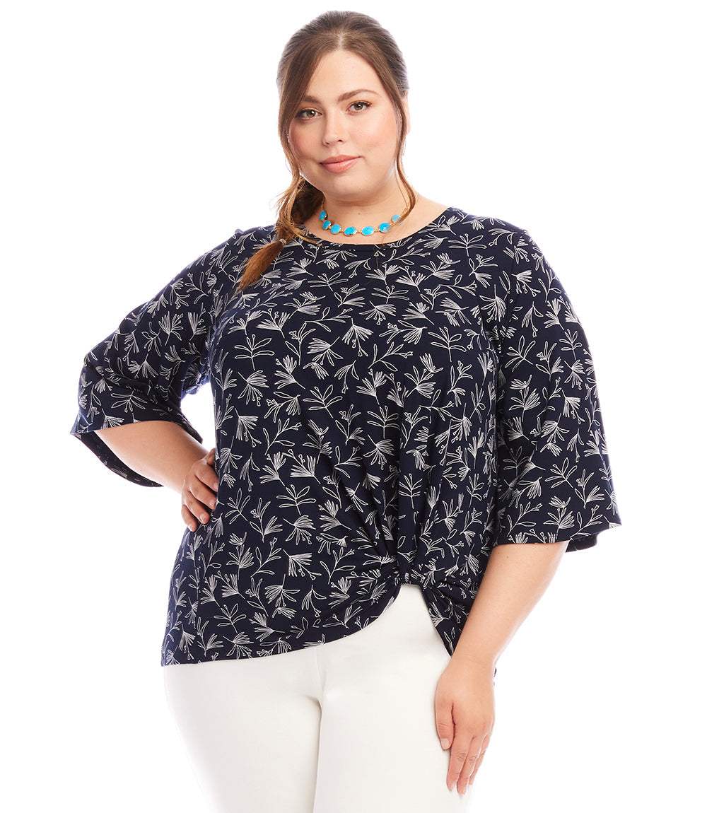 Plus size flare sleeve top with white floral print on navy, twist hem, and scoop neck