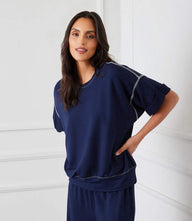 Off white cuffed sleeve tee with contrast stitching and relaxed fit in heavy French terry fabric