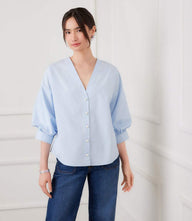 White lantern sleeve top with pearl buttons and V-neck in cotton poplin