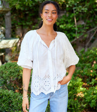 Feminine puff sleeve embroidered top with tie-neck and button front closure in cotton fabric